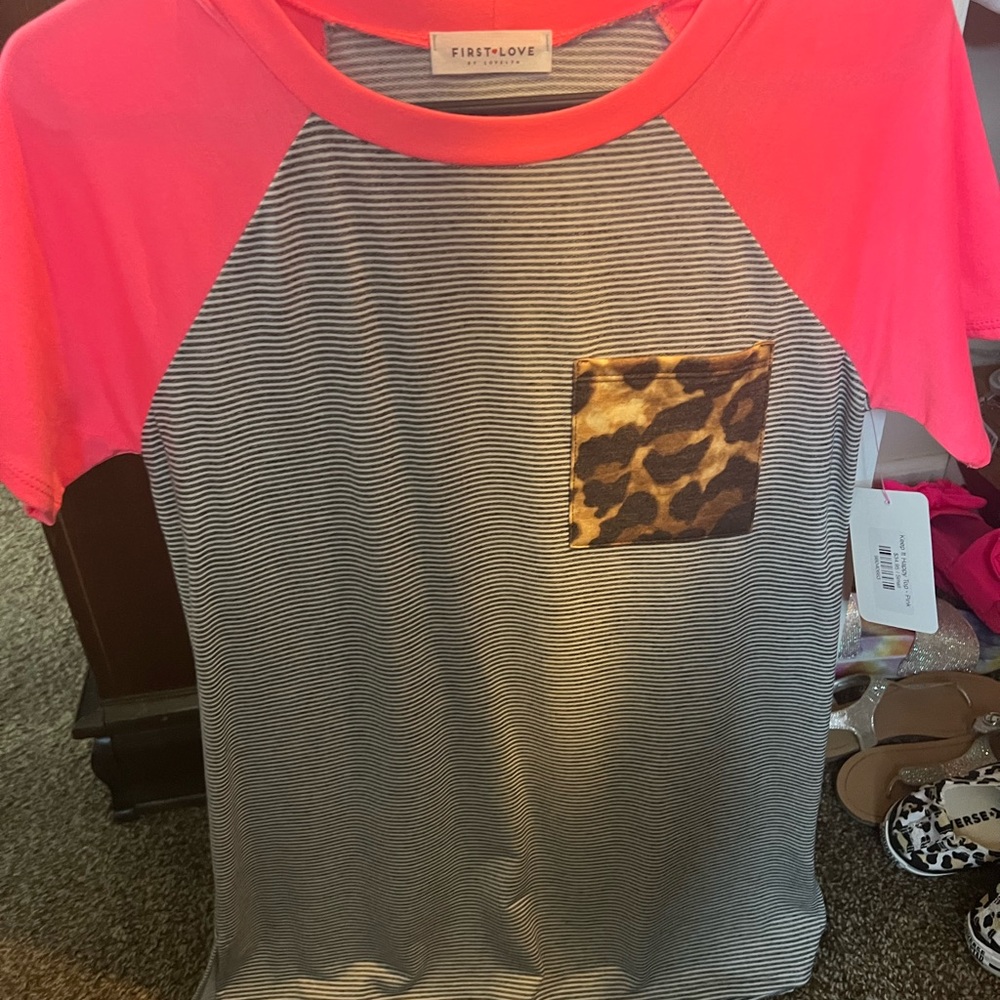 Striped top with neon pink sleeves and leopard pocket